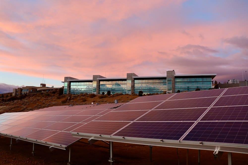 A solar panel array in an open field.