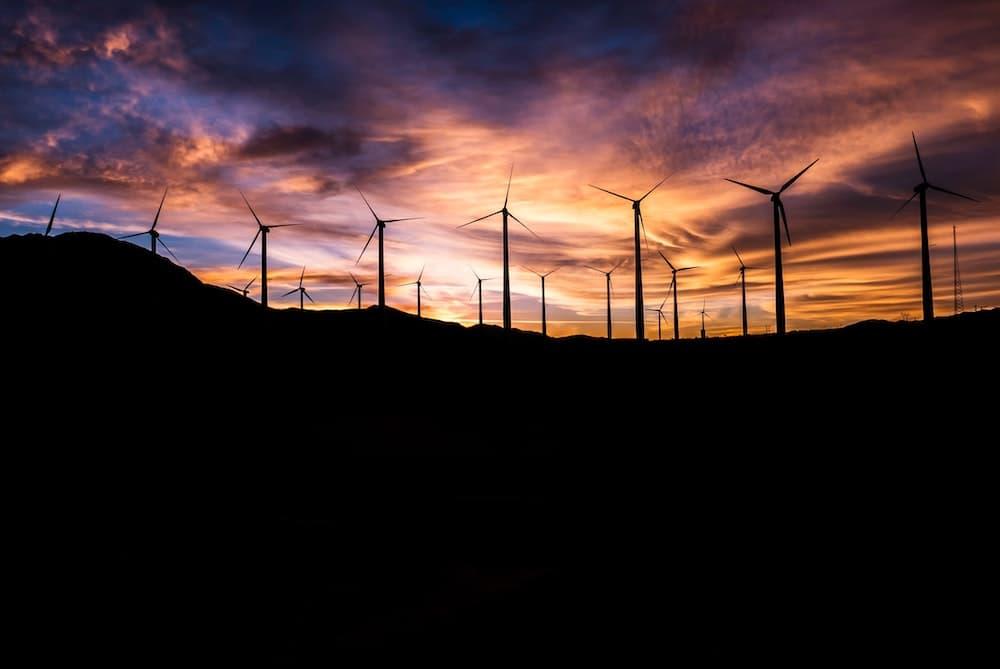 Wind turbines at sunset.
